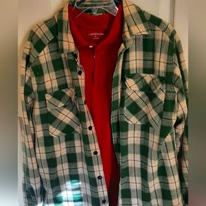Two shirts. A plaid flannel over shirt and a long sleeve red polo. Size XL